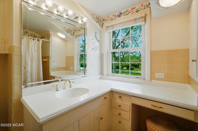 2297 June Dr, Lima, OH 45805 - bathroom with vanity, tile walls, a shower with curtain, and a wainscoted wall