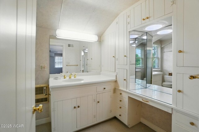 2297 June Dr, Lima, OH 45805 - full bath with vanity, healthy amount of natural light, lofted ceiling, and a ceiling fan