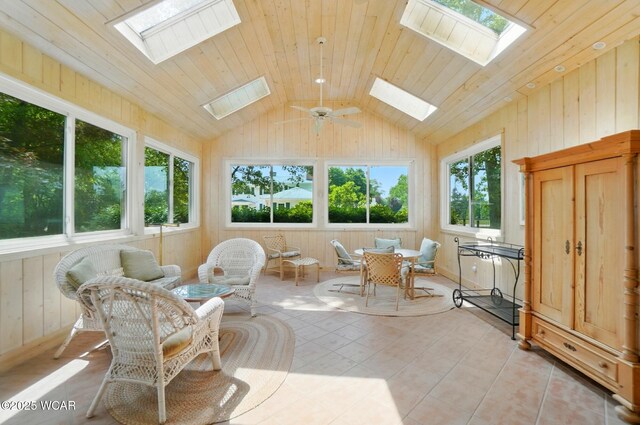 2297 June Dr, Lima, OH 45805 - sunroom with a skylight, vaulted ceiling, wooden walls, and tile patterned flooring