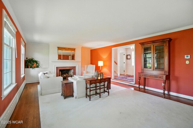 2297 June Dr, Lima, OH 45805 - living area with a fireplace, wood finished floors, and ornamental molding