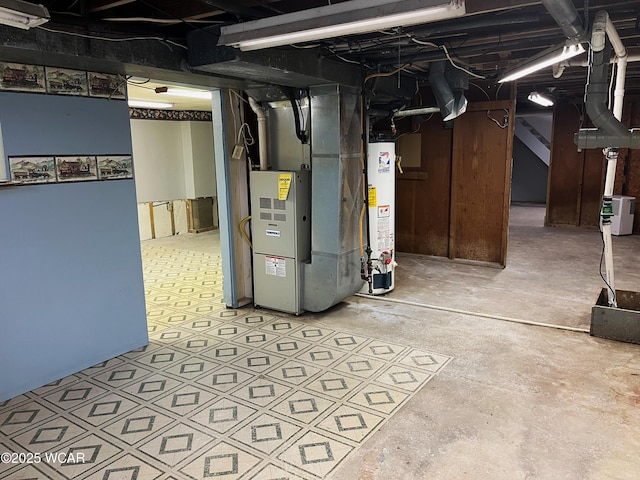 unfinished basement featuring gas water heater and heating unit