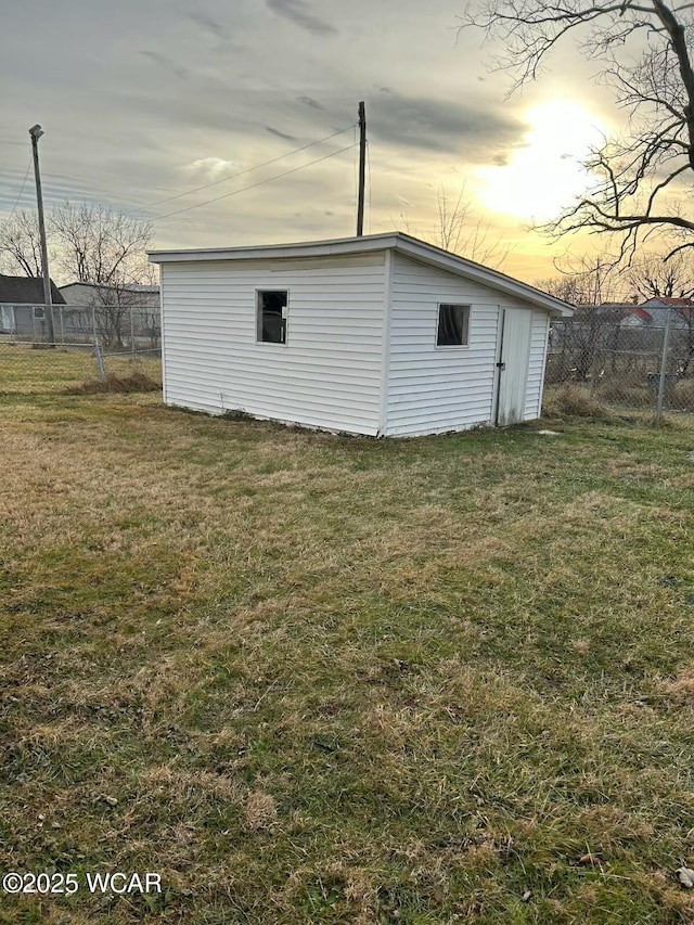 outdoor structure at dusk with a lawn