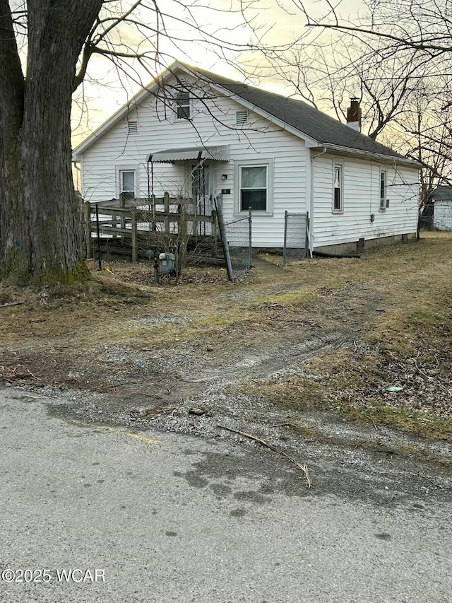 view of front facade with a wooden deck