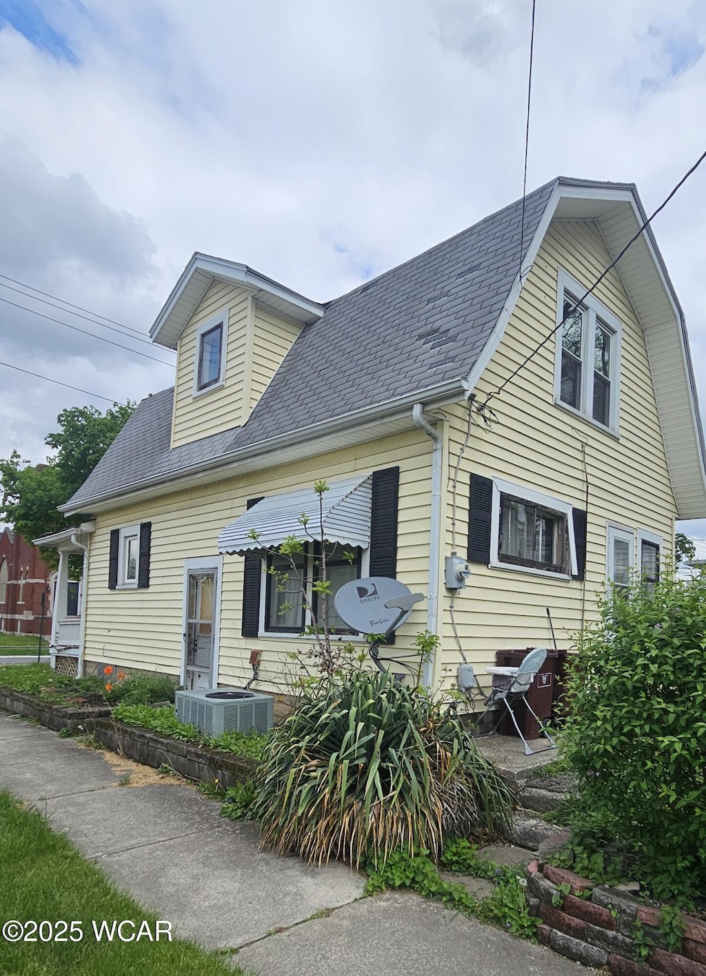 1179 W High St, Lima, OH 45805 - view of front of property with cooling unit and a shingled roof