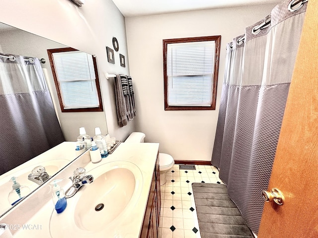 4095 N Cole St, Lima, OH 45807 - bathroom featuring vanity, toilet, healthy amount of natural light, and baseboards