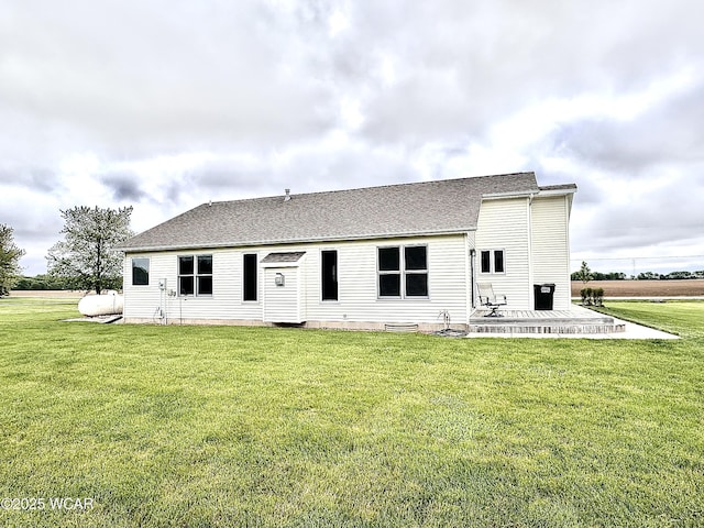 4095 N Cole St, Lima, OH 45807 - back of property with a yard, roof with shingles, and a patio