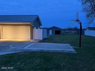 exterior space featuring a garage and an outdoor structure