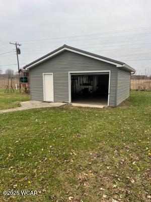 garage with a lawn