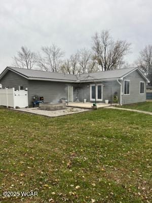 view of front of home with a front lawn and a patio