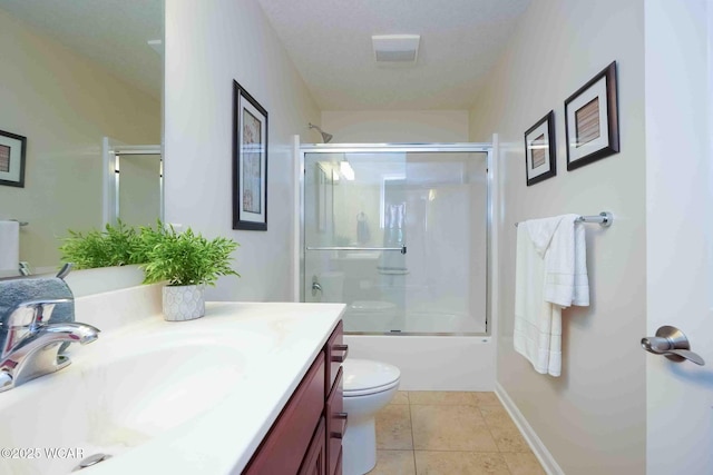 17210 State Route 694, Ottawa, OH 45875 - bathroom with vanity, combined bath / shower with glass door, toilet, and tile patterned flooring