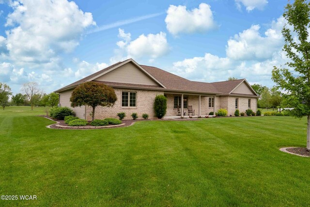 17210 State Route 694, Ottawa, OH 45875 - ranch-style house featuring brick siding and a front yard