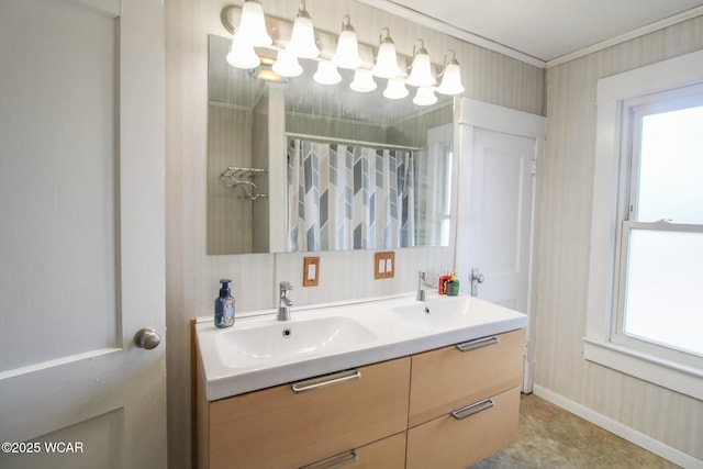 full bath featuring a shower with shower curtain, baseboards, wallpapered walls, double vanity, and a sink