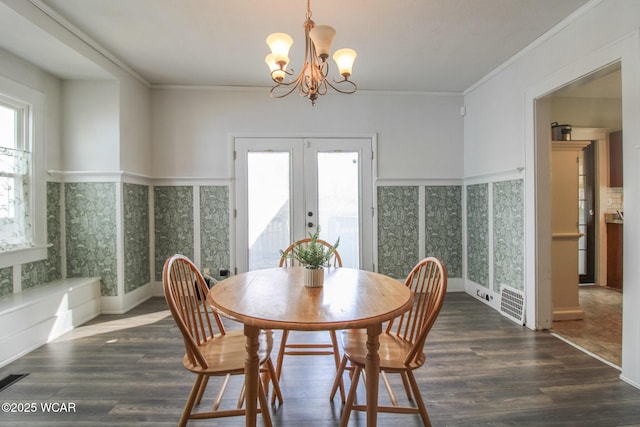 dining area featuring a wealth of natural light, french doors, and wood finished floors