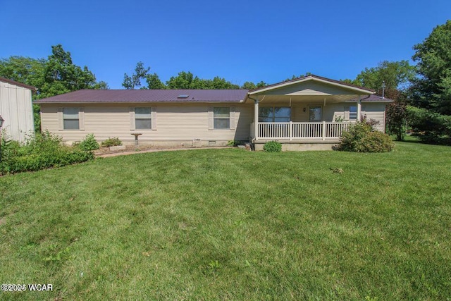 back of property featuring crawl space, a lawn, metal roof, and a porch