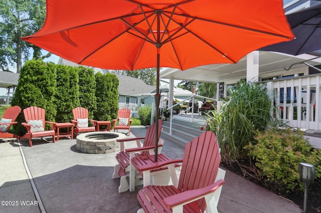 7407 Mingo Way, Russells Point, OH 43348 - view of patio with an outdoor fire pit