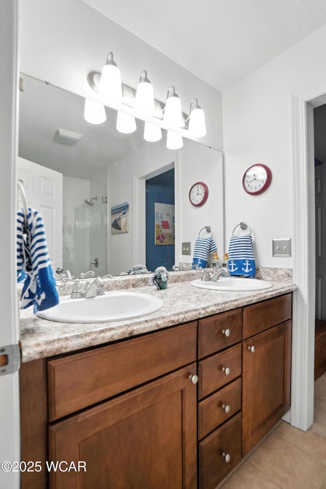 7407 Mingo Way, Russells Point, OH 43348 - full bathroom with double vanity, tile patterned floors, and a stall shower