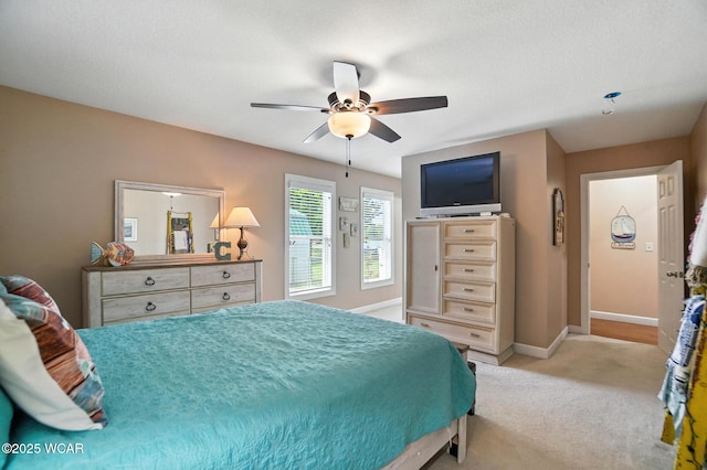 7407 Mingo Way, Russells Point, OH 43348 - bedroom with light carpet and ceiling fan