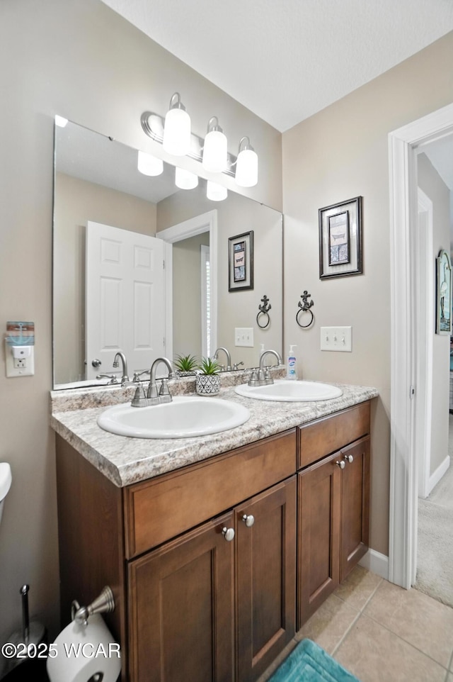 7407 Mingo Way, Russells Point, OH 43348 - bathroom featuring double vanity and tile patterned flooring