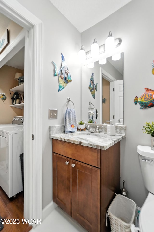 7407 Mingo Way, Russells Point, OH 43348 - half bath with washer / clothes dryer and vanity