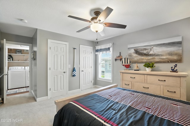 7407 Mingo Way, Russells Point, OH 43348 - bedroom with independent washer and dryer, multiple closets, light carpet, and a ceiling fan