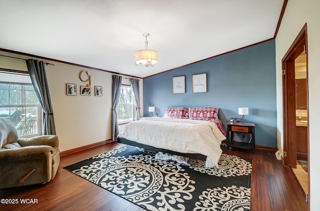 bedroom featuring dark hardwood / wood-style flooring, ornamental molding, and lofted ceiling