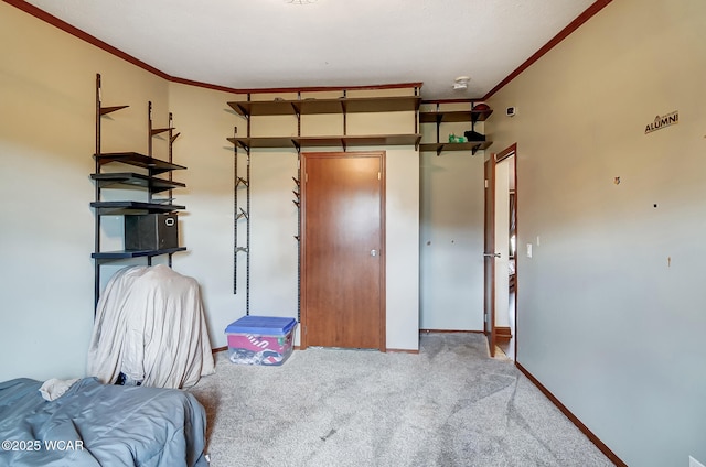 bedroom featuring ornamental molding and carpet flooring