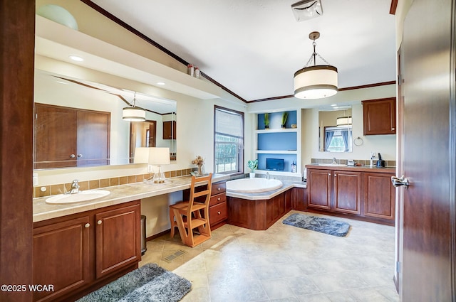 bathroom with vanity, lofted ceiling, ornamental molding, and a tub to relax in