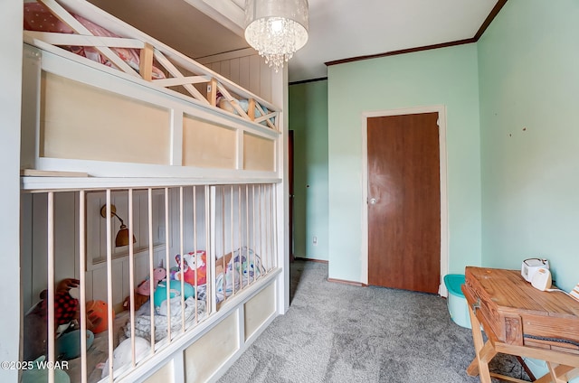 bedroom featuring crown molding, a chandelier, and carpet