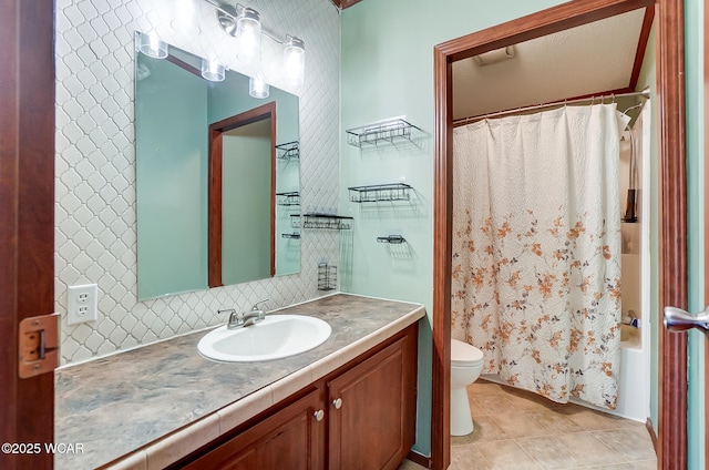 full bathroom featuring shower / tub combo with curtain, backsplash, tile patterned flooring, vanity, and toilet