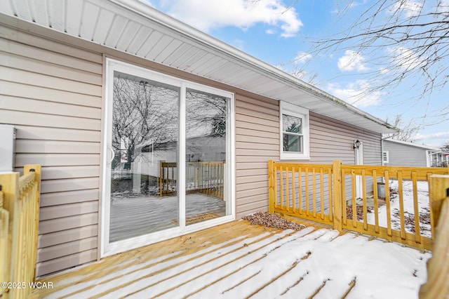 view of snow covered deck