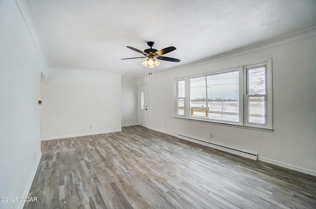 unfurnished room with ceiling fan, baseboard heating, light hardwood / wood-style flooring, and ornamental molding