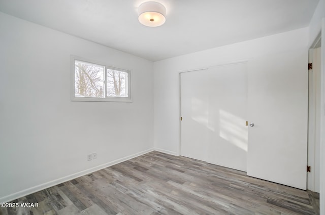 spare room with light hardwood / wood-style flooring