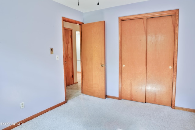 4940 Stewart Rd, Lima, OH 45801 - unfurnished bedroom featuring carpet floors, baseboards, and a closet