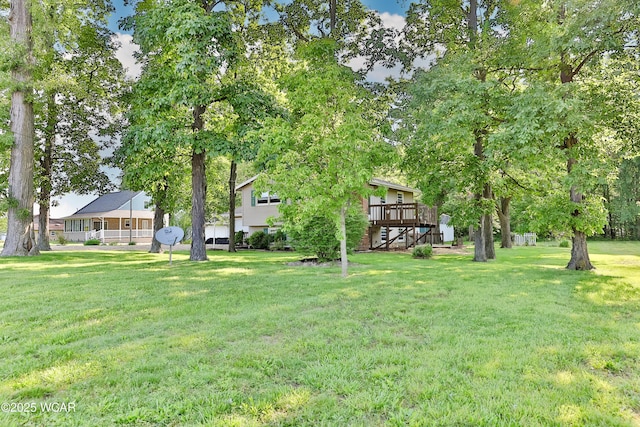 4940 Stewart Rd, Lima, OH 45801 - view of green lawn featuring stairs and a deck
