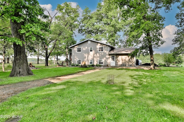 4940 Stewart Rd, Lima, OH 45801 - tri-level home featuring a front lawn