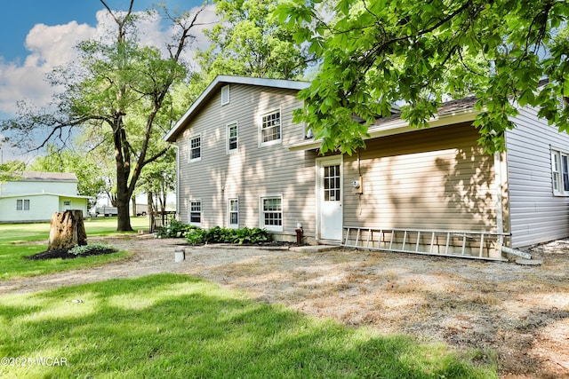 4940 Stewart Rd, Lima, OH 45801 - rear view of house with a lawn