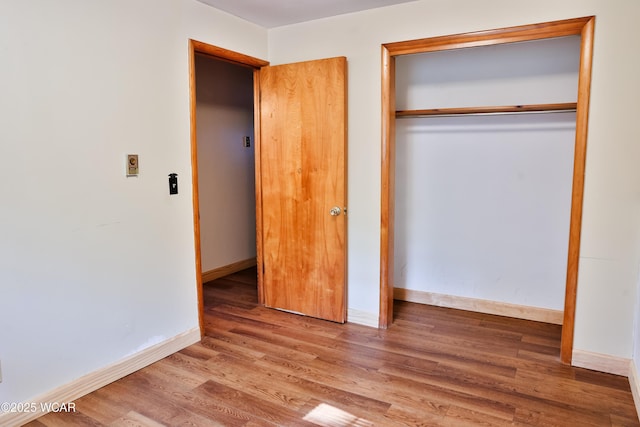 4940 Stewart Rd, Lima, OH 45801 - unfurnished bedroom with wood finished floors, a closet, and baseboards