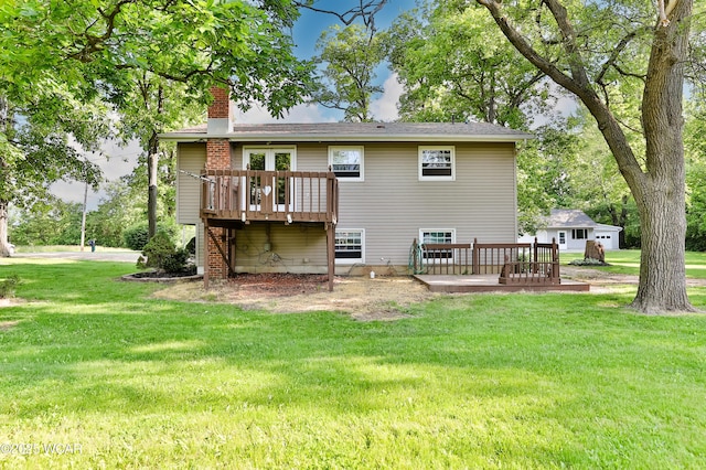 4940 Stewart Rd, Lima, OH 45801 - rear view of house with a deck, a chimney, and a lawn