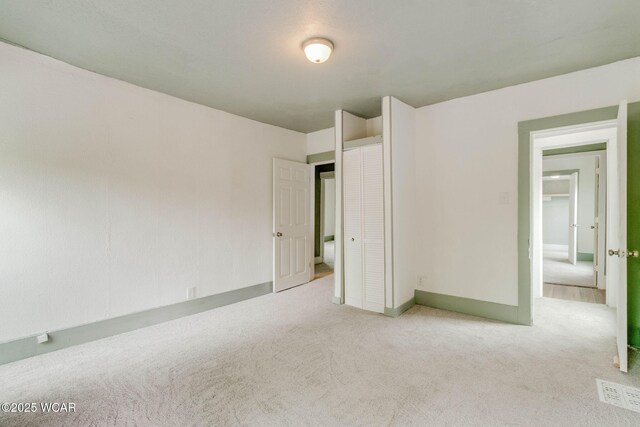 1157 W High St, Lima, OH 45805 - unfurnished bedroom featuring carpet floors