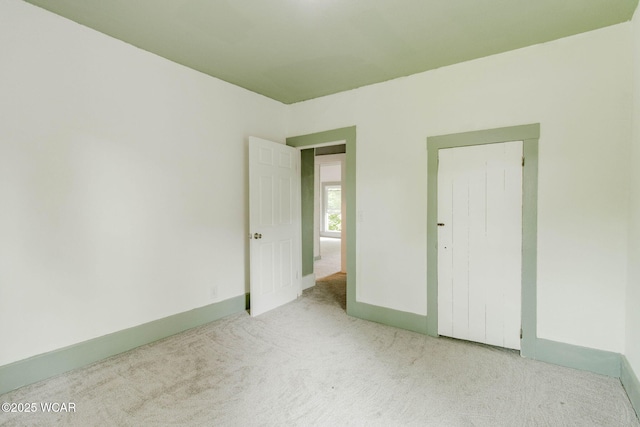 1157 W High St, Lima, OH 45805 - unfurnished bedroom featuring carpet and baseboards