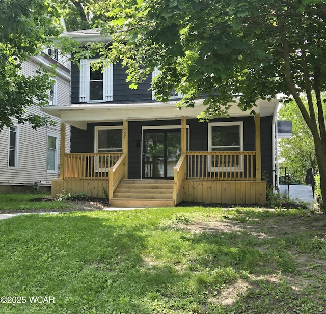 1157 W High St, Lima, OH 45805 - american foursquare style home featuring covered porch and a front yard