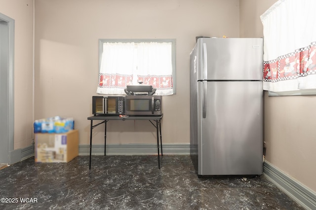 209 E Auburn Ave, Bellefontaine, OH 43311 - kitchen with stainless steel appliances and baseboards