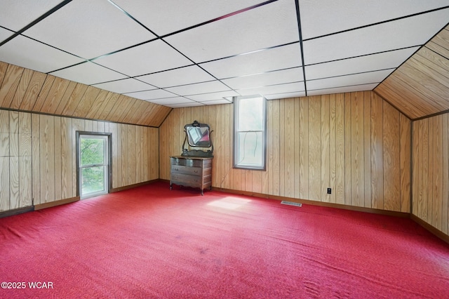 100 W S St, Columbus Grove, OH 45830 - bonus room with wood walls, carpet floors, vaulted ceiling, and baseboards