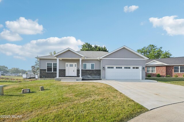 6856 Creekview Ct, Huntsville, OH 43324 - view of front of house featuring concrete driveway, an attached garage, and a front lawn