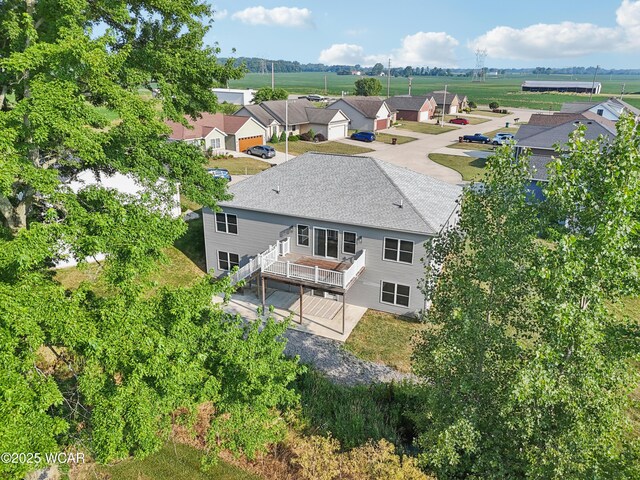 6856 Creekview Ct, Huntsville, OH 43324 - back of house with a hot tub, a shingled roof, stairway, a wooden deck, and a patio