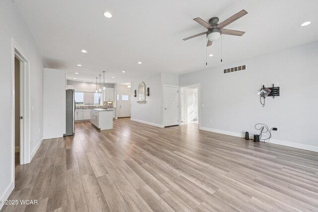6856 Creekview Ct, Huntsville, OH 43324 - kitchen featuring light wood-style flooring, recessed lighting, a ceiling fan, and stainless steel refrigerator with ice dispenser