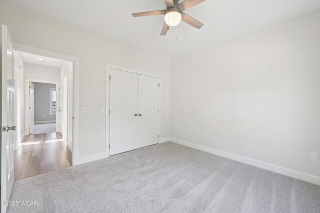 6856 Creekview Ct, Huntsville, OH 43324 - laundry area featuring visible vents, washer and clothes dryer, cabinet space, light wood-style floors, and baseboards