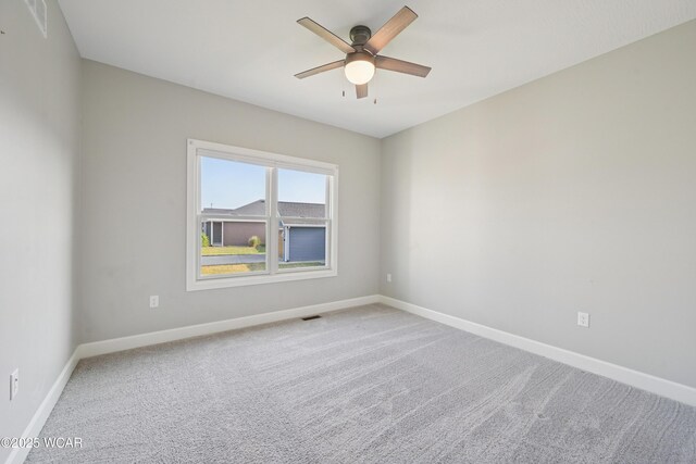6856 Creekview Ct, Huntsville, OH 43324 - bedroom featuring a ceiling fan, light colored carpet, and baseboards