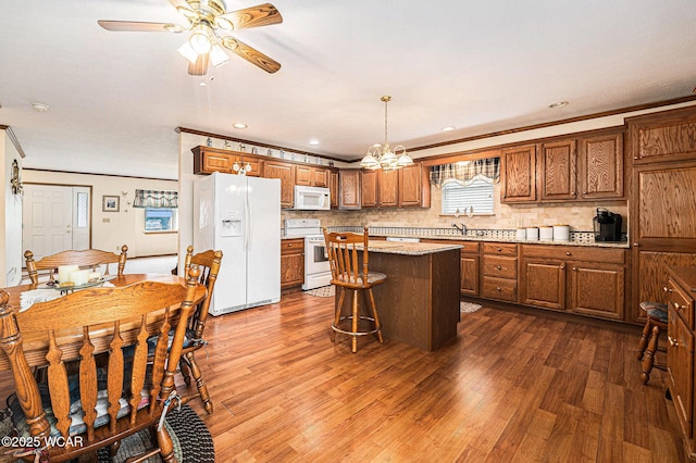 354 Stone Hedge Ln, Kenton, OH 43326 - kitchen featuring white appliances, dark wood finished floors, brown cabinets, tasteful backsplash, and ornamental molding