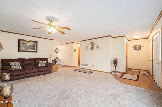 354 Stone Hedge Ln, Kenton, OH 43326 - living room featuring ceiling fan, crown molding, and carpet flooring